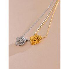 Add a touch of romance with our Gold Rose Pendant Necklace. This delicate floral charm necklace is perfect for elegant and everyday wear. Shop now at Tomoko Store for timeless beauty Finish: 18K Gold plated Waterproof: does not change color from water exposure Lead and nickel free Material: Stainless steel(waterproof!) Size: 42x5cm Weight: 5g All our jewelry are made of stainless steel material. For the gold pieces, we added an 18K PVD gold plating. This means the colour will last for a really l Rose Pendant Necklace, Stackable Jewelry, Color Making, Flower Stand, Golden Jewelry, Rose Pendant, Rose Necklace, Flower Pendant Necklace, Trendy Earrings