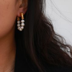 If you are looking for some earrings that goes well with simple black t-shirt but also make you stand out on a girls party, then our Eternity Pearl Hoop Earrings is here for you. Plated with 18k gold, the earrings feature two strands of freshwater pearls; they will definitely make a set with our Pearl Toggle Bracelet and Pearl Toggle Necklace. 18k gold plated Brass base Freshwater pearls Gold Pearl Drop Cartilage Earrings, Trendy Single Pearl Earring For Everyday, Trendy Everyday Pearl Drop Earrings, Trendy Pearl Drop Earrings For Everyday, Trendy Single Hoop Pearl Earring, Minimalist Single Huggie Earring For Party, Toggle Necklace, Toggle Bracelet, Pearl Hoop Earrings