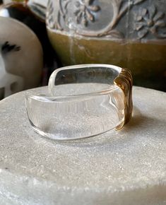 Beautiful Modernist Lucite Sculpted Brass Vintage Cuff Bracelet See matching Earrings in link below https://www.etsy.com/listing/757469418/beautiful-modernist-lucite-sculpted?ref=shop_home_active_3&frs=1 See matching necklace in link below https://www.etsy.com/listing/771354061/beautiful-modernist-lucite-sculpted?ref=related-1&frs=1 Modern Lucite Bangle Jewelry, Handmade Elegant Clear Bracelets, Clear Bangle Jewelry For Formal Occasions, Elegant Handmade Clear Bracelets, Clear Bangle For Formal Occasions, Formal Gold Lucite Jewelry, Modern Clear Bracelet Jewelry, Clear Bracelet Jewelry For Formal Occasions, Elegant Clear Bangle Jewelry