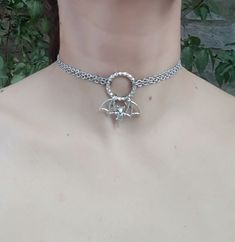 PLEASE read my shop announcement before placing an order so you know what to expect right now. Plus, when ordering from outside Europe, don't forget to provide a phone number for the courier to ensure the fastest and smoothest delivery. Witchy bat choker O ring necklace. Perfect for Samhain / Halloween, or your witchy everyday Short necklace, total length is 13 inches, about 43 cm. It fastens with a strong lobster clasp, and has a 2 inches, 5cm., extension chain. I can make this in your desired Punk Style Halloween Festival Jewelry, Metal Jewelry For Halloween Festival, Punk Style Jewelry For Halloween Cosplay, Witchy Jewelry For Halloween Festival, Silver Choker For Halloween Gift, Witchy Silver Jewelry For Parties, Handmade Silver Jewelry For Cosplay, Sterling Silver Jewelry For Halloween Party, Adjustable Jewelry For Halloween Cosplay