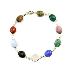 "14k yellow gold gemstone scarab bracelet featuring petite unikite, red jasper, black onyx, blue lace agate, blue onyx, carnelian, green onyx and tiger eye which are meticulously hand set into rich 14k yellow gold bezels. Egyptian style \"Scarab\" stones are 100% all natural. The scarab gemstones measure 8mm X 10 mm each." Scarab Bracelet, Blue Onyx, Ankle Chain, Star Bracelet, Fine Jewelry Bracelets, Yellow Gold Bracelet, Blue Lace Agate, Red Jasper, Green Onyx