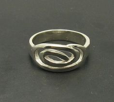 Sterling silver ring 925/1000. Stamped 925. Approximate weight 4.5 grams. Top width 0.9cm. All our jewels are made from solid sterling silver 925/1000 and are carefully crafted by hand in our family workshop. We dispatch your orders in 5 working days, worldwide and the postage is $5. We ship registered priority mail. Please allow 5-7 working days for delivery in Europe and 10-15 working days outside Europe. For any questions - please do not hesitate to contact me! Spiral Sterling Silver Ring Stamped 925, Silver Spiral Sterling Silver Ring, Spiral Sterling Silver Rings, Silver Spiral Ring With Polished Finish, Sterling Silver Spiral Ring, Fantasy Earrings, Sterling Silver Thumb Rings, Cool Piercings, Snake Jewelry