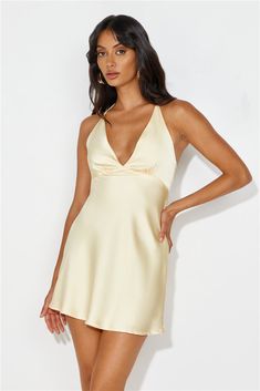 Length from bust to hem of size S: 73cm. Chest 35cm, Waist 32cm, across front only of size S. Mini dress. Lined. Model is a standard XS and is wearing size XS. True to size. Non-stretch. Elastic back. Halter tie. Tie-up back. Slip on. Cold hand wash only. Polyester. Level up your 'fit with the Yours To Love Satin Halter Mini Dress. Featuring an elastic back and a tie-up design! We're in love with this dress paired with heels and a sleek bun. Yellow Satin Mini Dress, Gold Hoco Dresses, Hoco Dresses White, Satin Dress Outfit, Gold Homecoming Dress, Yellow Homecoming Dresses, Halter Homecoming Dress, Pretty Homecoming Dresses, Short Yellow Dress