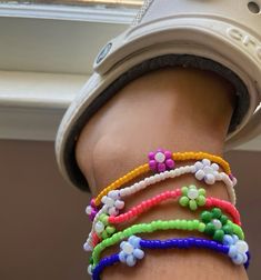 Add a pop of color to your summer look with these handmade beaded floral anklets. Perfect for beach outings and boho outfits, available in multiple sizes to fit any size.  All anklets are handmade! 🌿 Care 🌿 Avoid water, try and keep your anklet as dry as possible as discoloration may occur. Reminder the charm is elastic. In the event your anklet may become dirty use a damp cloth/paper towel to clean and then promptly dry. SAVE EXTRA! Save $15 by purchasing the 5 pack set of anklets. 🌿 Material 🌿 - Seed beads (8/0 and 6/0) - Elastic string Made to order 🌼 Summer Beach Accessories, Summer Accessories Beach, Cloth Paper Towels, Handmade Boho Jewelry, Jewelry Summer, Le Lot, Beach Accessories, Anklet Jewelry, Body Jewellery