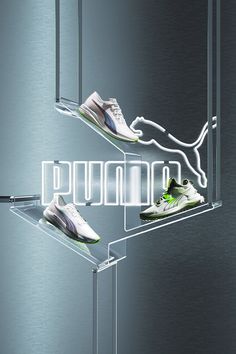 three pairs of running shoes on display in front of a mirror