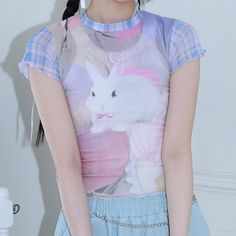 Harajuku Kawaii Aesthetic Pastel Y2K Bunny Print Mesh Tshirt Measurements S Bust: 74cm/29.1" Length: 44cm/17.3" M Bust: 78cm/30.7" Length: 45cm/17.7" L Bust: 82cm/32.2" Length: 46cm/18.1" *This product is see-through. We recommend layering another top underneath. *Standard shipping time to the US is 9-19 business days. Please consult our shipping page for shipping time estimates for other countries. *Please check the measurements/size chart very carefully when ordering from The Kawaii Factory. M Harajuku Cartoon Print Summer Top, Harajuku Style Cartoon Print Summer Top, Summer Harajuku Tops With Cartoon Print, Harajuku Style Graphic Print Tops For Summer, Y2k Printed Streetwear Tops, Y2k Printed Tops For Streetwear, Fitted Anime Print Tops For Streetwear, Fitted Pink Harajuku Style Tops, Y2k Printed Crew Neck T-shirt