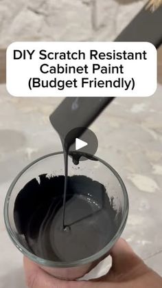 a person is holding a paintbrush and mixing it into a bowl with the words diy scratch resistant cabinet paint budget friendly