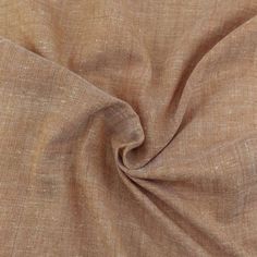 a close up view of a tan fabric