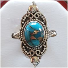 Beautiful Southwestern Rope Design Encaptures This Stunning Copper Turquoise. Set In 925 Stamped Sterling Silver. Please See All Pictures For Details And Measurement. Brand New. Never Worn. Wholesale Prices Always....Or Less. Artisan Turquoise Ring Stamped 925, Artisan Blue Turquoise Ring Stamped 925, Bohemian Blue Turquoise Ring Stamped 925, Adjustable Sterling Silver Turquoise Ring In Western Style, Blue Artisan Turquoise Ring Nickel Free, Western Style Stamped 925 Turquoise Ring, Western Style Blue Turquoise Ring In Sterling Silver, Western Style Blue Sterling Silver Ring, Adjustable Western Style Blue Turquoise Ring