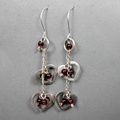 #Heart #Earrings,#Silver,Long #Dangle,2 designed Hearts,Red Garnet Beads, Romantic, Joyful, #Valentines,#accessories #JewelryByVita https://www.etsy.com/listing/182953808/ Heart Earrings Silver, Unique Gifts For Girls, Silver Heart Earrings, Bracelets Design, Women's Bracelets, Handmade Jewelry Designs, Bracelet Ideas, Earrings Long, Design Silver