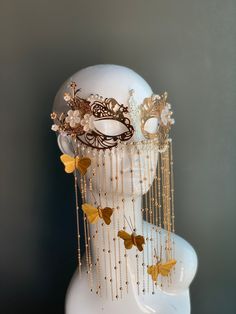 This elegant golden metal masquerade mask features dangling butterflies with floral notes and pearls. The mask is made out of comfortable and lightweight metal, great for long time wear! I N C L U D E D Mask comes with matching ribbons. S H I P P I N G -  Processed same day or within 24 hours.  1-2 day guaranteed delivery, add item to cart, click shipping tab for rates.  Pls leave a check out note with your need date & contact number  Msg for delivery time frames (Include your state/country) S I Luxury Masks And Prosthetics For Mardi Gras, Gold Masquerade Mask For Mardi Gras Festival, Gold Fantasy Masquerade Mask For Party, Gold Fantasy Style Masquerade Mask For Party, Gold Fantasy Style Masquerade Mask, Gold Adjustable Masquerade Mask, Gold Carnival Masks As Gift, Gold Adjustable Masks For Masquerade, Adjustable Gold Masks For Masquerade