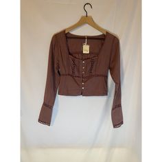 This Beautiful Free People Joi Blouse Is Perfect For Any Occasion, Whether It's A Casual Day Out Or A Travel Adventure. The Blouse Features A Square Neckline And Classic/Fitted Sleeves With Button Accents. It Is Made Of 100% Cotton And Is Machine Washable For Easy Care. The Blouse Is A Size Xs And Has A Regular Fit With An Elastic Waist For Added Comfort. It Comes In A Stunning Purple Color And Has A Solid Pattern With Eyelet Detailing. This Blouse Is Perfect For The Winter, Fall, And Spring Sea Fitted Cropped Blouse For Festival, Spring Fitted Cropped Peasant Top, Fitted Cropped Peasant Top For Spring, Cropped Blouse For Festivals, Cropped Blouse For Festival, Bohemian Fitted Crop Top Blouse, Bohemian Long Sleeve Fitted Crop Top, Fitted Bohemian Crop Top Blouse, Bohemian Fitted Long Sleeve Crop Top