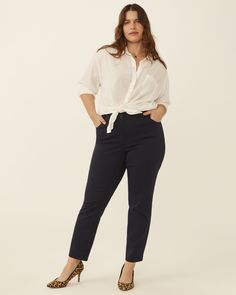 Crafted from a stretchy cotton-blend fabric, these ankle pants combine classic style with supreme comfort. Belt loops and buttoned back pockets add refined finishing touches. These plus size ankle pants look chic and polished when paired with a chambray top. Ryan Wylde Paris Cropped Pant | Navy | Pants | Materials & Care Instructions: 54% Cotton, 32% Polyester, 2% Spandex, 12% Rayon, Machine wash cold Cute Teacher Outfits, Work Blazer, Chambray Top, Silky Blouse, Denim Blazer, Plus Size Pants, Cropped Blazer, Solid & Striped, Work Wardrobe