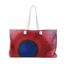 a red and blue bag with white handles