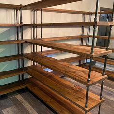 the shelves are made out of wood and metal