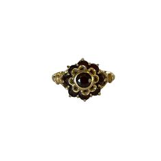 A stunning antique garnet cluster ring crafted in 14k yellow gold. This wonderful statement floral ring is set with nine deep red round cut garnet gemstones with a 1.05 ctw set in a bezel & prong setting. A wonderful addition to any antique jewelry collection. Featuring January birthstone. ERA - Circa 1930s/Art Deco Era METAL / MATERIAL - 14k yellow gold, 9 genuine garnets ( estimated 1.05 ctw) MARKINGS / HISTORY - 585 with a Star 2250AL CONDITION - Very good vintage condition. All garnets are present and in nice shape, with only very minor surface wear. Piece has been cleaned and lightly polished. Lovely antique cluster ring! SIZE / MEASUREMENTS - Size: 6 1/2, Ring head length: 11.82 mm, Back of shank: 2 mm,Weight: 2.80 grams, Yellow Gold Garnet Ring With Rose Cut Diamonds, Antique Multi-stone Yellow Gold Cluster Ring, Antique Multi-stone Cluster Ring In Yellow Gold, Victorian Multi-stone Yellow Gold Rings, Heirloom Yellow Gold Cluster Ring With Gemstone, Antique Gold Cluster Ring With Multi-stone, Victorian Gold Cluster Ring With Gemstone, Antique Yellow Gold Cluster Ring With Gemstone, Heirloom Yellow Gold Cluster Ring With Multi-stone