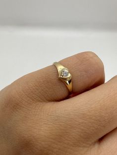 This cute 14K gold heart signet ring with a center stone is the perfect size for a baby, child, or pinky ring for women. The center stone is a simulated pink or white diamond (Cubic Zirconia). The ring is made of 100% 14K gold. It's a beautiful ring for a little girl or a gorgeous pinky ring.  Ring pictured on woman's 2 1/2 pinky finger    * 14K Solid Gold * High Quality Cubic Zirconia Stone * Small sized Ring ▬ All jewelry pieces are sent in a gift box  ▬ Our shipping and return policies: ~ Ite Women’s Pinky Rings, Heart Pinky Ring, Womens Pinky Ring, Small Gold Rings, Gold Pinky Ring Women, Little Finger Rings For Women, Pinkie Rings For Women, Pinky Ring Stack, Pinky Ring Aesthetic