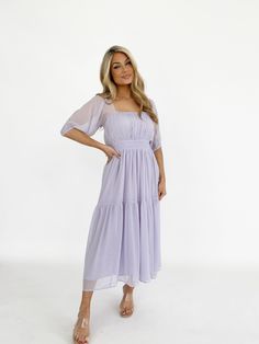 Indulge in the sheer balloon quarter sleeves, tiered flowy ruching, and soft, textured smocked fabric of the Soiree Sweetness Dress. The square neckline, bright pop of color, and elevated, back cutout detail make this midi fit perfect for spring and summer occasions like dinner, drinks, vacation, and wedding guest appearances. Self 100% Polyester Hand wash cold. Flowy Purple Dress, Dinner Drinks, Bright Pop, Spring Dresses, Purple Dress, Xl Dress, Quarter Sleeve, Square Neckline, Dresses Xs