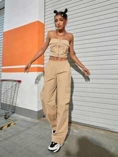 Our Tube Top And Flap Pocket Wide Leg Cargo Pants will give your everyday wardrobe a major upgrade. When it comes to style, these beige pants have you covered. With multiple pockets for pocket flaps, you’ll never be without a place to store your goodies. Whether you're on the go or kicking back, you'll be doing it in style. So step out boldly and watch those heads turn. Specifications: Style: Casual Pattern Type: Plain Details: Pocket, Ruched Bust Neckline: Strapless Top Type: Bandeau Bottom Typ Beige Utility Pants With Flap Pockets, High-waisted Beige Cargo Pants, High Waist Beige Cargo Pants With Cargo Pockets, High-waist Beige Parachute Pants With Side Pockets, Beige High Waist Parachute Pants With Side Pockets, High Waist Beige Cargo Pants With Side Pockets, High Waist Beige Cargo Jeans With Pockets, Beige High-waist Cargo Pants With Side Pockets, Beige High-waisted Cargo Parachute Pants