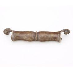 an antique brass drawer pull handle with scrolled handles on the front and back ends