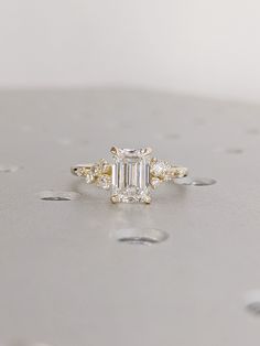 an engagement ring with three stones on it