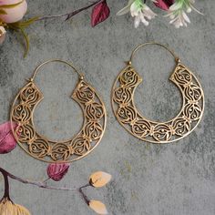 Gold Hoop Earrings With Pierced Copper, Gold Crescent Spiritual Earrings, Gold Hoop Spiritual Jewelry, Gold Plug Earrings For Festivals, Bohemian Crescent Hoop Earrings With Ear Wire, Symbolic Round Pierced Hoop Earrings, Bronze Hoop Pierced Earrings, Intricate Design Jewelry For Festival, Gold Cartilage Earrings With Ear Wire For Festival