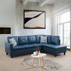 a living room with a blue sectional couch