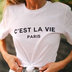 Chic Graphic Short Sleeved Tee In White With Black Casual High Quality Cotton 100% Cotton Longer Length Tee White Letter Print Top For Day Out, Chic Spring Tops With Letter Print, Chic Spring Top With Letter Print, Spring Chic Top With Letter Print, Chic Text Print Tops For Spring, Paris Fashion Summer, Paris Graphic, Yoga Long Sleeve, French Outfit