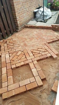 an outdoor patio being built with bricks