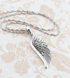 Splendid Angel Wing Necklace in Sterling Silver | FREE Shipping in USA – woot & hammy Elegant Silver Wing-shaped Necklace, Silver Winged Engraved Jewelry, Winged Engraved Jewelry For Gifts, Engraved Wing-shaped Jewelry For Gifts, Engraved Wing-shaped Jewelry Gift, Silver Leaf-shaped Necklaces For Gift, Elegant Silver Necklace With Angel Wings, Spiritual Winged Sterling Silver Jewelry, Silver Leaf-shaped Necklace Gift