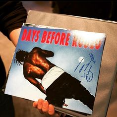 a person holding up a record with the cover of his album days before k - pop