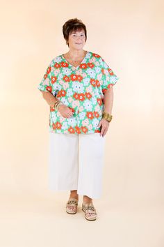 Stay cool and refreshed in this Sunny Refresh Floral V-Neck Top. The lightweight green fabric features bold, contrasting colors of red, blue and pink flowers, while the short sleeves and classic v-neck offer a timeless silhouette. Perfect for any summer occasion. Pair it with Judy Blue Jeans and sandals for a Spring season look! Model: Kristen is wearing a size small. Abby is wearing a size large. Maci is wearing a size 2XL. Nancy is wearing a size 2XL. Size Suggestions and Measurements: Small: Casual Floral Print V-neck Top For Summer, Casual Green V-neck Short Sleeve Top, Casual Summer V-neck Top With Floral Print, Casual Floral Print Short Sleeve V-neck Top, Spring V-neck Top For Day Out, Spring V-neck Top For Day Out With Relaxed Fit, Spring Relaxed Fit V-neck Top For Day Out, Casual Short Sleeve V-neck Top With Floral Print, Spring Vacation V-neck Top