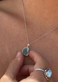 [Color: Green] A white gold plated sterling silver base necklace with a unique sea glass charm in green. Silver Necklaces Pendant, Unique Silver Necklaces, Silver Beach Jewelry, Beach Silver Jewelry, Seaglass Necklaces, Seaglass Jewelry, Beach Glass Necklace, Pearl Clasp, Necklaces Silver