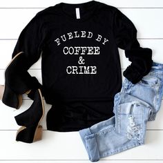 Fueled By Coffee And Crime Long Sleeve Tee, Crime Junkie Life Rule Shirt! Murderinos, Crime Junkies, True Crime Lovers rock this shirt! This classic unisex long sleeve tee fits like a well-loved favorite. Casually elegant, with an excellent quality print it is an irreplaceable everyday item. *Check size chart in photos for best fit!* .: Retail Fit .: 100% Soft cotton (fibre content may vary for different colors) .: Light fabric (4.2 oz/yd² (142 g/m .: Tear away label .: Runs true to size ☠ PRODU Coffee Long Sleeve T-shirt With Letter Print, Long Sleeve Slogan Shirt In Relaxed Fit, Casual Long Sleeve Coffee T-shirt, Coffee Long Sleeve Top With Letter Print, Coffee Color Long Sleeve Top With Letter Print, Coffee Long Sleeve T-shirt With Graphic Print, Coffee Color Long Sleeve Graphic T-shirt, Coffee Color Long Sleeve T-shirt With Graphic Print, Coffee Long Sleeve Cotton Top