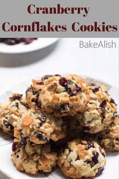 cranberry cornflakes cookies on a white plate with the title above it