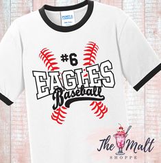 We will customize this design with YOUR team name and your favorite player's number! **THE WHITE/BLACK RINGER SHIRT IS ONLY AVAILABLE IN UP TO AN ADULT 3X** We use only Thermaflex Professional Vinyl- rated for 100+ washes without peeling. **Due to different computer screens settings, colors may vary slightly.** We will ship in 5-7 business days. Once shipped, your item should arrive in 3-5 business days. If you need this sooner, please message us for availability. We are also happy to customize Varsity Baseball Jersey With Team Name For Sports Season, College Sports Fan Baseball Jersey With Letter Print, Sports Fan T-shirt With Team Name For Baseball Season, Sports Fan T-shirt For Baseball Season, Collegiate Baseball Jersey With Letter Print For Team Events, Varsity Baseball Jersey In Team Colors With Team Name, Varsity Baseball Jersey With Letter Print For Fan Gear, Varsity Style Baseball Jersey With Letter Print, Team-colored Varsity Baseball Jersey With Letter Print