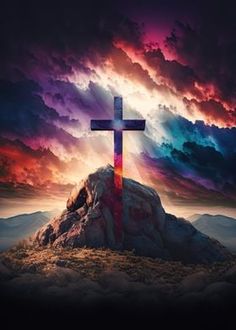 a cross sitting on top of a mountain under a cloudy sky