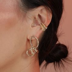 These face framing knots are funky and formal at the same time. Ready for your glam night out or a normal day at the office, you’re guaranteed to get compliments on these. Trendy Gold Ear Cuff For Party, Gold Trendy Party Ear Cuff, Modern Gold Ear Cuff For Party, Modern Ear Cuff With Matching Earrings, Trendy Ear Cuff With Matching Earrings For Party, Gold Ear Cuff For Party, Elegant Clip-on Ear Cuff, Gold Party Ear Cuff, Modern Clip-on Ear Cuff