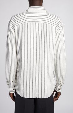 The Italian fashion house offers a relaxed take on a classic button-up with this pinstriped sweater-knit shirt featured in the label's spring '24 runway show. 28 1/2" length; 43" chest (size Medium) Hidden-button placket Spread collar Long sleeves with button cuffs 50% cotton, 50% linen Dry clean Made in Italy Designer Clothing Striped Shirt With Button Cuffs For Fall, Casual Pinstripe Tops With Button Cuffs, Classic Pinstripe Tops With Relaxed Fit, Classic Pinstripe Tops With Button Cuffs, Casual Pinstripe Tops For Business Casual, Striped Tops With Button Cuffs And Relaxed Fit, Classic Striped Shirt For Fall, Pinstripe Shirt For Business Casual, Casual Pinstripe Shirt For Business Casual