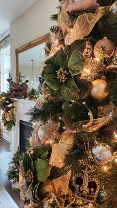 a christmas tree decorated with gold and green ornaments