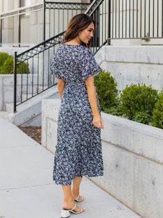 Looking for a dress that will make you stand out in a crowd? Look no further than the Floral Pattern Whitney Dress in mint floral! This dress is all about fun and flirty style, with a colorful floral print that's sure to turn heads. But it's not just about looks - this dress is designed to flatter your curves, with a tie waist that accentuates your figure. And with flutter sleeves and a midi length, it's the perfect combination of playful and sophisticated. Whether you're headed to a wedding, a Blue Printed Midi Dress For Garden Party, Blue Ditsy Floral Print Knee-length Dress, Blue V-neck Midi Dress With Ditsy Floral Print, Blue Midi Dress With Ditsy Floral Print For Brunch, Chic Blue Printed Floral Dress, Blue Floral Print Midi Dress, Blue Printed Floral Dress For A Day Out, Blue Knee-length Ditsy Floral Dress, Blue Floral Sundress For Garden Party