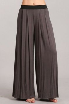 Another Fabulous Creation From Chatoyant! Casual wide leg palazzo pants for everyday wear! Pleated detail provides a relaxed fit and flexible sizing for all body types. Black contrast elastic waistband provides the ultimate stretch and all-day comfort without hanging loose or falling down. Fabric: Rayon/Spandex 95/5 Jersey Proudly made in the USA Stay Sexy! Wide Leg Full Length Pants With Solid Color, Baggy Wide Leg Loungewear Pants, Versatile Baggy Wide Leg Pants With Elastic Waistband, Solid Full Length Wide Leg Pants With Elastic Waistband, Loosely Fitted Wide Leg Pants, Trendy Stretch Wide Leg Harem Pants, Chic Solid Color Wide Leg Yoga Pants, Chic Wide Leg Yoga Pants, Chic Wide Leg Yoga Pants With Loose Fit