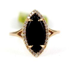 This Is A Fancy Marquise Cut Onyx & Diamond Lady's Ring. It Is Made Of 100% Natural 14kt Rose Gold And Is In Brand New Condition. It Has A Ctw Of 2.05ct (0.15 Diamond/1.90 Onyx) And Weighs 2.9 Grams. The Fancy Diamonds Have A Clarity Of Si1 And H Color. This Beautiful Custom Piece Has An Excellent Marquise Cut Onyx Stone, Surrounded By A Diamond Halo. Vintage Wedding Rings Black Diamond, Elegant Black Marquise Cut Diamond Ring, Black Marquise Diamond Rings, Black Marquise Diamond Jewelry, Black Marquise Engagement Ring, Nontraditional Engagement Rings, Black Onyx Engagement Ring, Future Engagement Rings, Black Wedding Rings