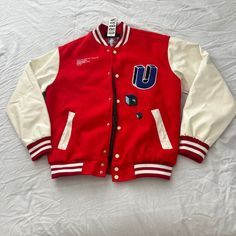 Urban Outfitters Graphic Varsity Jacket Size Medium Condition: Nwt Color: Red Multi Details : - Graphic Varsity Jacket By Urban Outfitters - Classic Look Jacket With Embroidery At The Front And Back - Snap Front Closure And Fitted With Striped Ribbed Knit Trims. Extra: - I Ship Between 1-2 Days Urban Red Long Sleeve Varsity Jacket, Red Long Sleeve Varsity Jacket With Patchwork, Red Patchwork Varsity Jacket, Red Patchwork Long Sleeve Varsity Jacket, Red Varsity Outerwear With Patchwork, Red Patchwork Outerwear For Streetwear, Red Patchwork Outerwear For College, Urban Red Varsity Jacket For Winter, Red Urban Varsity Jacket For Winter