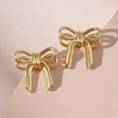 Brand New In Box Minimalist Designed Bow Earrings Features A Cute Ribbon Shape That Pierces The Earlobe. These Small Bow Earrings Can Be A Cute And Elegant Addition To Your Jewelry Collection. Add A Touch Of Elegance And Sophistication To Any Daily Look. Gold Bow Earrings - Measure 0.78inches High, 0.67 Inches Wide.It's Light Weight And Comfortable For Wearing. 14k Gold Plated. Gold Plated Earrings For Valentine's Day Formal, Gold Plated Earrings For Valentine's Day Formal Occasions, Gold Earrings For Mother's Day Formal Occasion, Elegant Gold Earrings For Mother's Day, Dainty Earrings For Valentine's Day Party, Dainty Valentine's Day Party Earrings, Gold Earrings For Valentine's Day Formal, Gold Earrings For Valentine's Day Formal Occasion, Party Earrings For Mother's Day