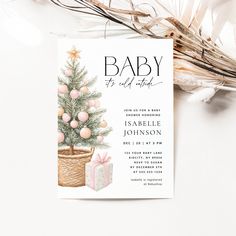 a baby shower is shown with a christmas tree in a basket and presents on the table