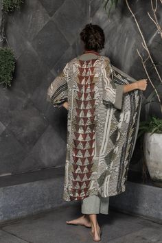 This unique, beautiful robe for women is made from a super soft rayon fabric. It is printed with a multicolor original Oriki print incorporating warm grey tones with patterns of blacks and reds. It is the ideal boho style kimono robe for women who want something different without sacrificing comfort. This robe has long sleeves, plain colored borders and falls at about mid-calf length. My designs feature my original graphics and illustrations. I love working with different color palettes and desi Boho Robes, Robe For Women, Man Clothes, Burning Man Outfits, Digital Fashion, Womens Robes, Grey Tones, Warm Grey, Rayon Fabric