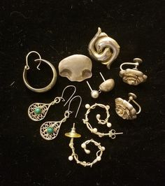 "This lot includes three pair of wearable earrings and five single earrings.   Included in this lot: ~ 3/4\" vintage Sterling Danecraft screw-on rose design earrings ~ 3/4\" vintage unmarked silver filigree pierced earrings with green stones.  ~ 1\" artisan pearl and wire silver tone earrings. ~ 5 single earrings including an MMA (Museum of Modern Art) dolphin design, a MEXICO earring, and a wavy earring engraved \"Sterling Cathryn\". Even though this lot is all in very good condition, please un Vintage Single Earring For Everyday, Vintage Single Earring For Everyday Wear, Sterling Silver Clip-on Earrings For Everyday, Sterling Silver Clip-on Earrings Set For Everyday, Vintage Everyday Earrings With Ear Wire, Vintage Pierced Jewelry For Everyday, Vintage Everyday Pierced Jewelry, Vintage Everyday Jewelry, Handmade Silver Costume Jewelry Earrings