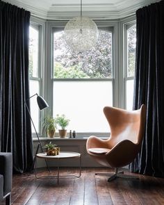 the instagram page shows an image of a chair in front of a window