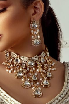 Polki & Pearl Drops Bridal Necklace Set - Joules By Radhika Ignite your bridal charm with our 22KT Gold Plated necklace set! Featuring Hydro Polkis, lustrous pearls, and delicate white freshwater pearl drops, this enchanting ensemble exudes elegance. Perfect for weddings, it adds a touch of eternal grace to your special day, ensuring you shine bright and beautiful. Make your wedding unforgettable with this captivating masterpiece! SET INCLUDES: Necklace and Earrings Details: Handcrafted with ❤️ Jewelry Design Bridal, Polki Bridal Jewellery Set, Jadau Jewellery Set, Jewelry Accessories Indian, Polki Bridal Set, Real Polki Jewellery, White Gold Charm Necklace, Pearl Indian Jewellery, Polki Bridal Jewellery